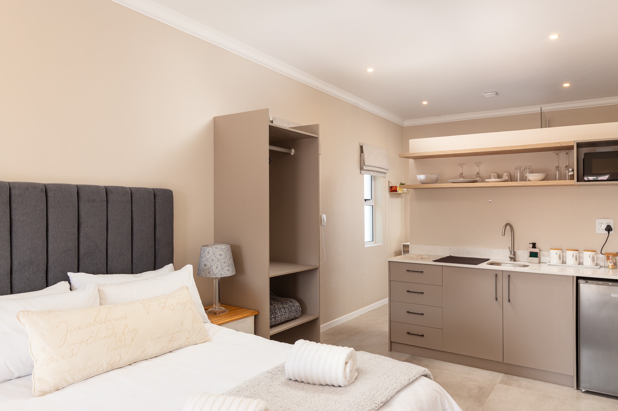Modern studio apartment bedroom and kitchen combined